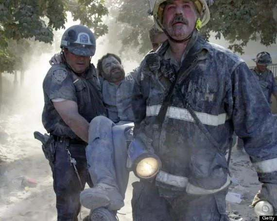 New York Daily News staff photographer David Handschuh is carried from site after his leg was shattered by falling debris while he was photographing the terrorist attack. (Photo by Todd Maisel/NY Daily News Archive via Getty Images)