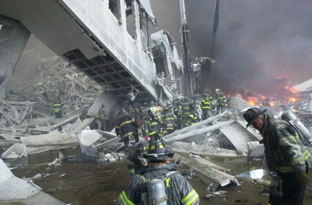 Firefighters look for survivors in the rubble of the World Trade Center. (Photo by Todd Maisel/NY Daily News Archive via Getty Images)