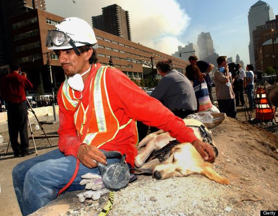 Saul Apunte and dog Shannon rest after a day of searching for survivors. (Photo by KMazur/WireImage)