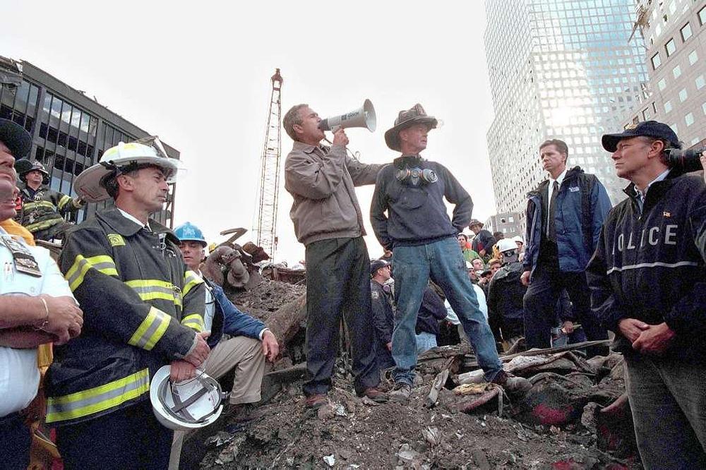 President George W. Bush encourages rescuers and firefighters at the scene of the attack in New York, September 14.
