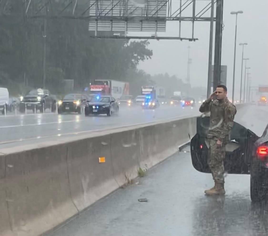 Soldier stopped in the rain to render respect