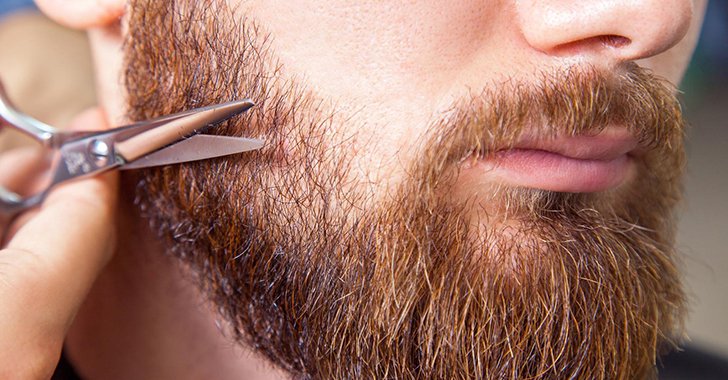 Man trimming his beard