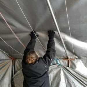 Removing the snow from the shelter roof