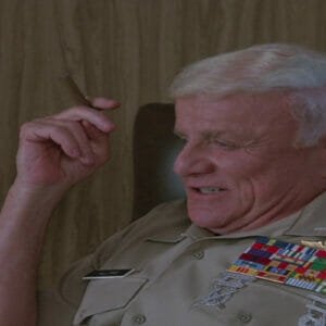 The Colonel smoking a cigar