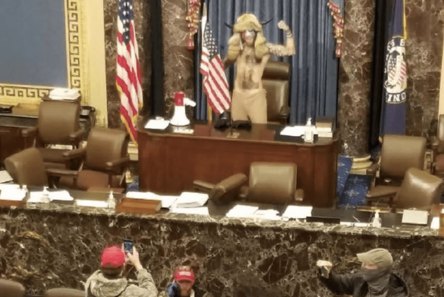 Jacob Chansley, aka QAnon Shaman on the Senate floor Jan 6 Jacob Chansley, aka QAnon Shaman on the Senate floor Jan 6