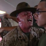 Sgt Richard Warren Sgt. Richard Warren, left, a drill instructor for Platoon 1058, Delta Company, corrects Rct. Jimmy Luong during “pickup” June 7, 2014, on Parris Island, S.C.