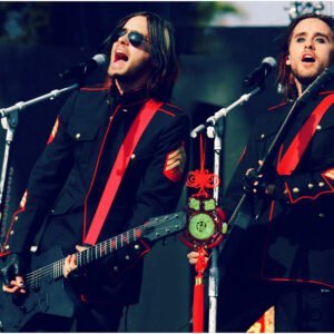 Jared Leto - 30 Seconds to Mars in a USMC dress blues jacket with Sgt stripes on stage at a concert