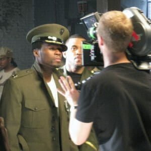 50 cent thinking he looks cool as hell in an Alpha's jacket