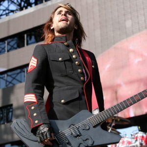Jared Leto - 30 Seconds to Mars in a USMC dress blues jacket with Sgt stripes on stage at a concert