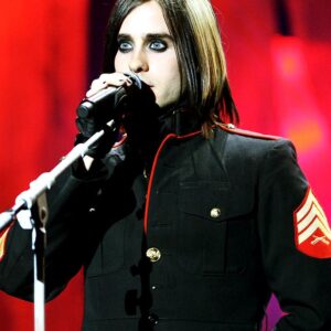 Jared Leto - 30 Seconds to Mars in a USMC dress blues jacket with Sgt stripes on stage at a concert