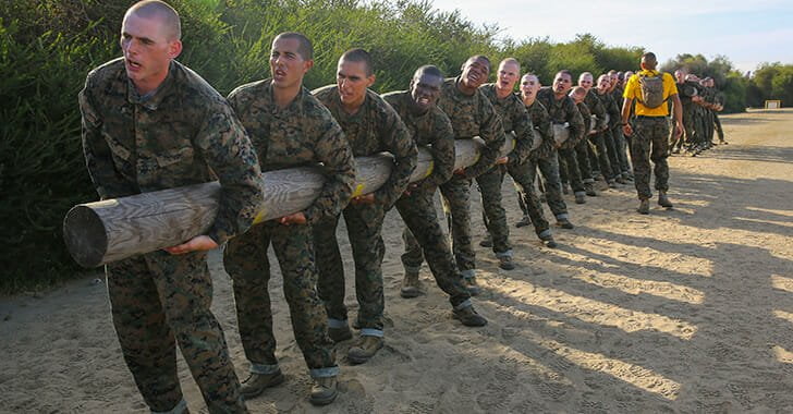 Marine Corp recruits doing log drills