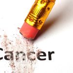 Erasing the word Cancer with a pencil eraser Erasing the word Cancer with a pencil eraser