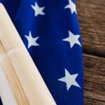 American flag with rolled up of constitution American flag with rolled up of constitution