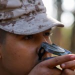 Rct. John Gialitis II, a recruit with Charlie Company, 1st Recruit Training Battalion, looks through his compass’ sighting wire during Basic Warrior Training at Marine Corps Recruit Depot Parris Island, S.C., Oct. 30, 2024 Rct. John Gialitis II, a recruit with Charlie Company, 1st Recruit Training Battalion, looks through his compass’ sighting wire during Basic Warrior Training at Marine Corps Recruit Depot Parris Island, S.C., Oct. 30, 2024